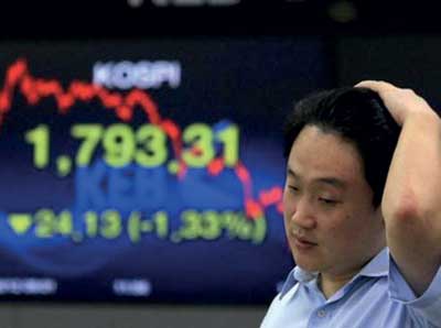 Dollar surges, Asia markets dive on Fed rates signal Image_1481807191-8dd8cf36b2